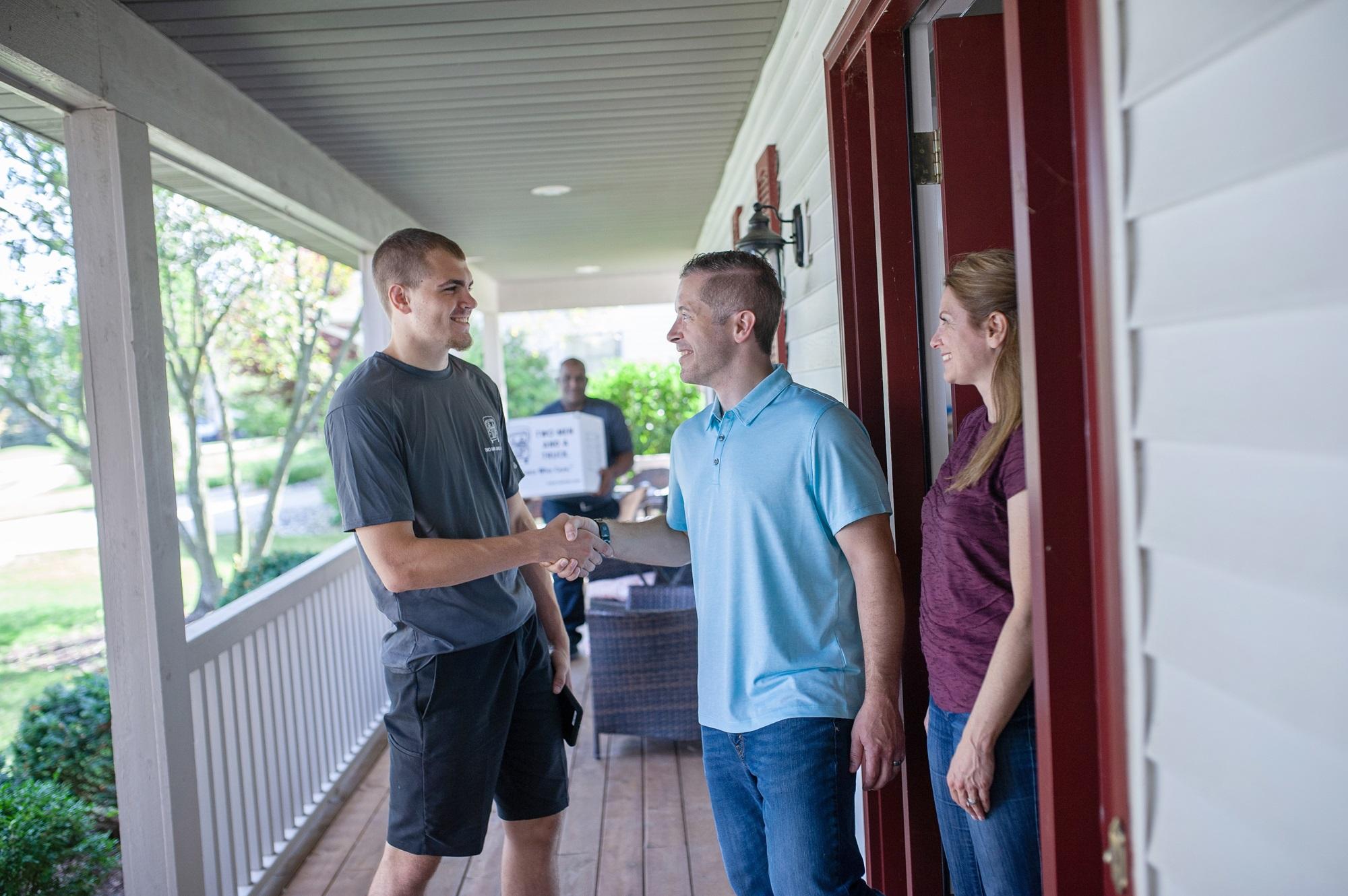 TWO MEN AND A TRUCK mover greeting customers 