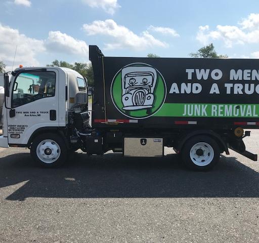 junk removal truck in a parking lot