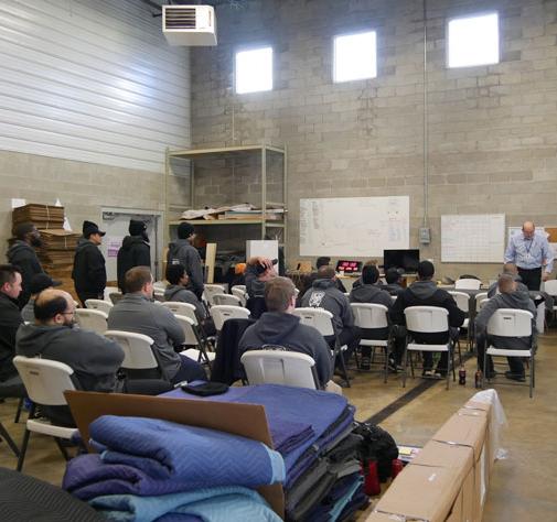 two men and a truck indianapolis company team training on best moving practices