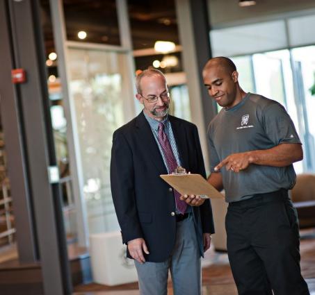 two men and a truck mover discussing business move