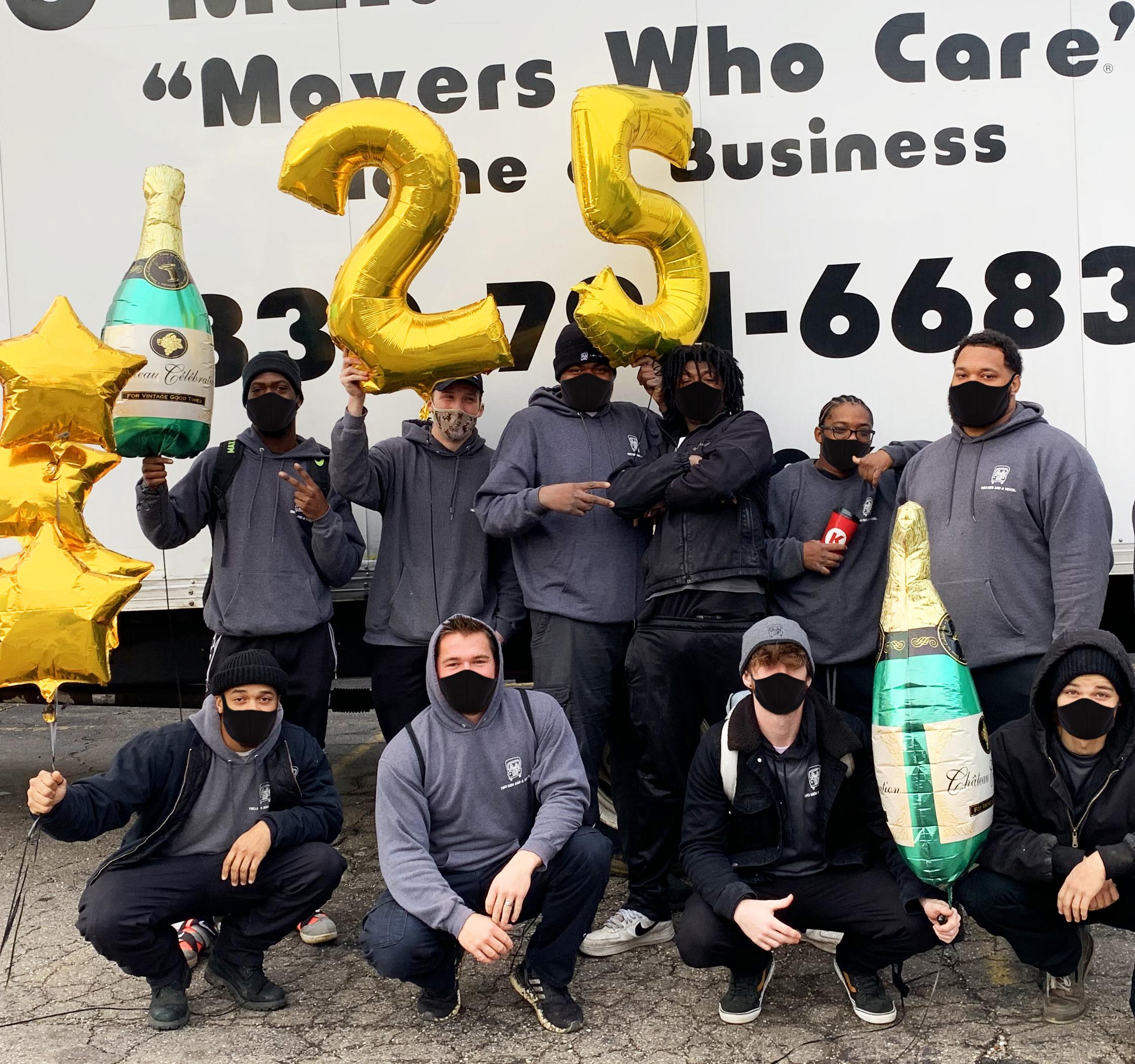 crew holding &#039;25&#039; balloons for 25th anniversary 