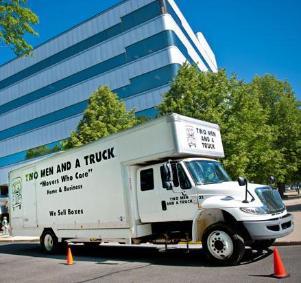 moving truck parked in front of an office building