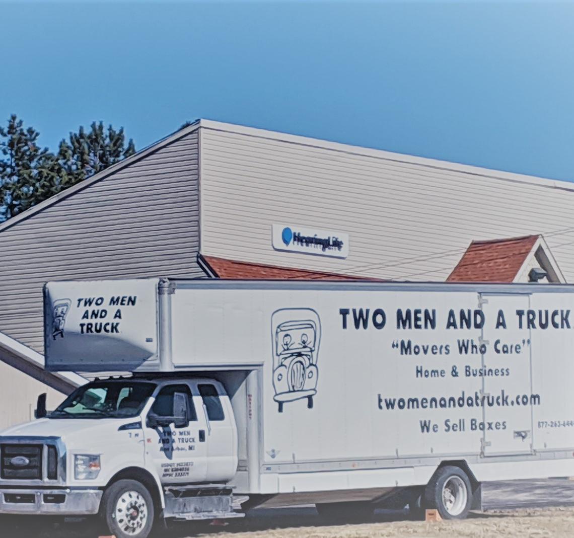 Moving truck parked in front of the business office