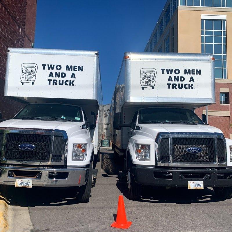 Image of two trucks downtown