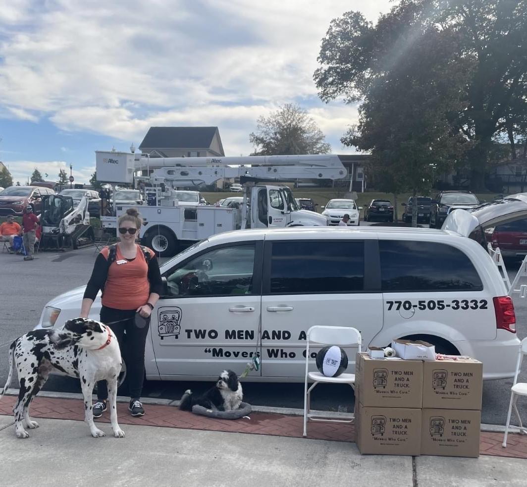 TWO MEN AND A TRUCK at a community shopping center pop-up event
