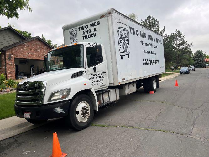 moving truck parked in front of a home