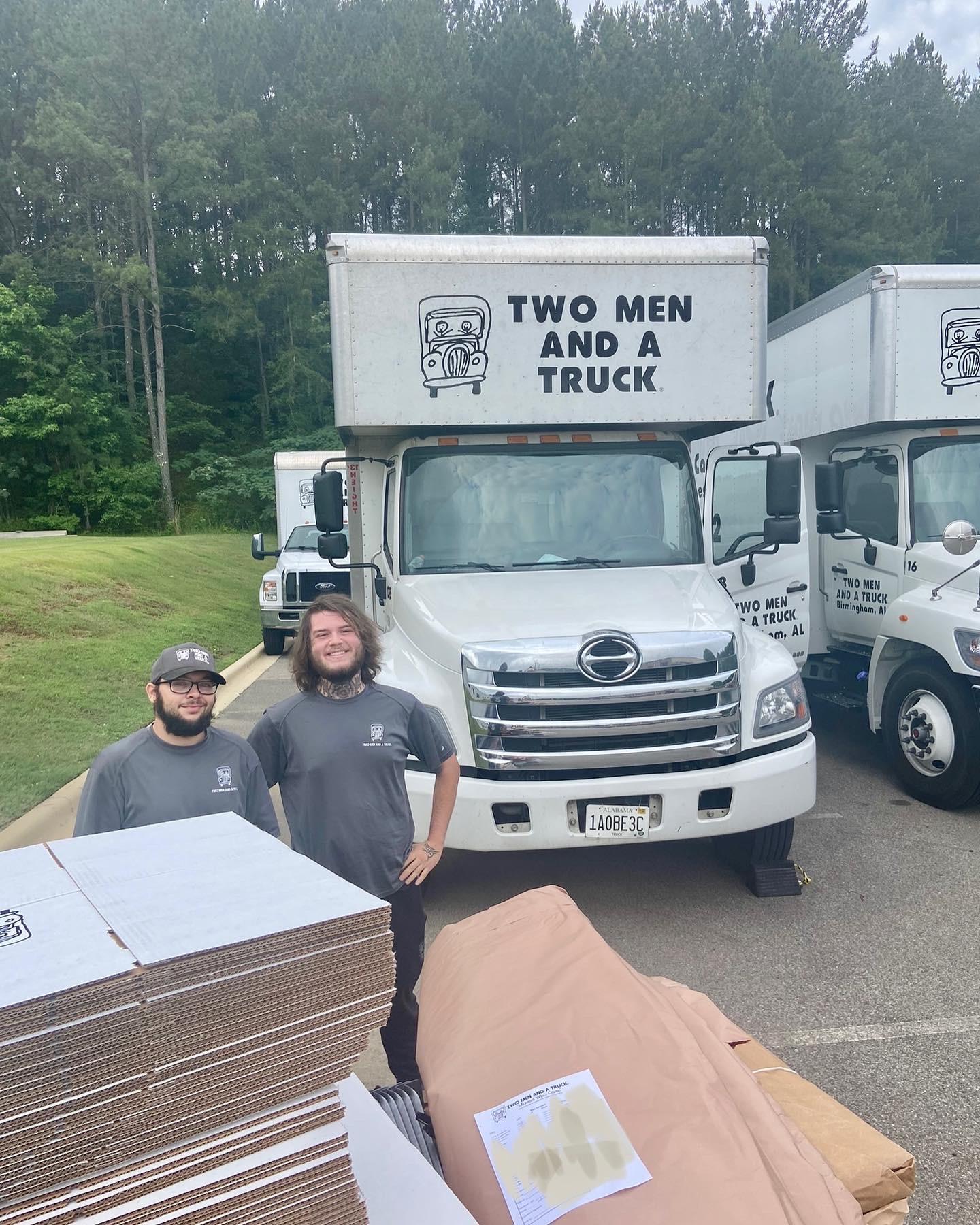Movers load the truck with packing supplies for the upcoming pack and move. 