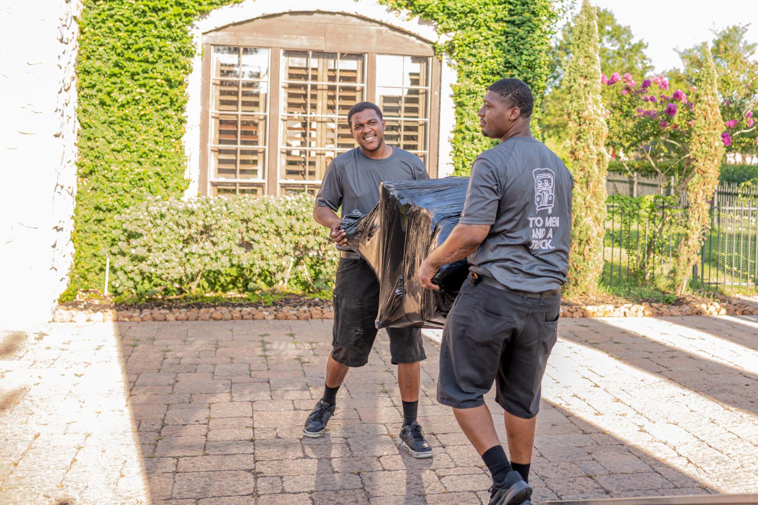 Movers carrying furniture