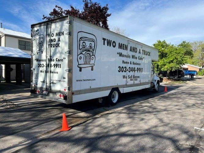 a moving truck in a parking lot