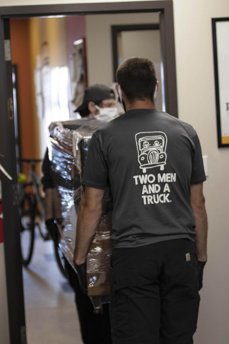 Two men training in lift and carry techinque