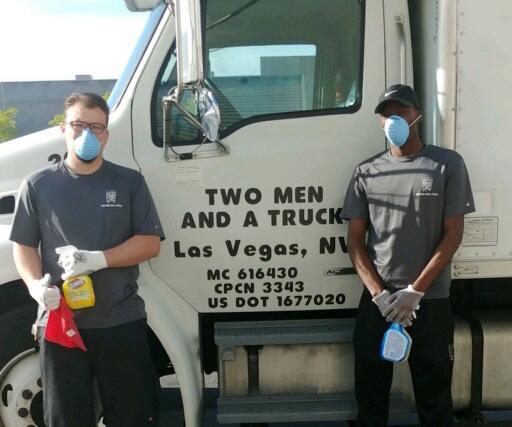 Team members next to truck with cleaning supplies