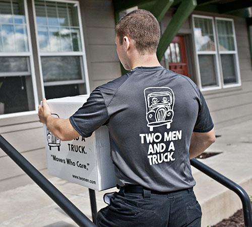 mover climbing stairs into apartment