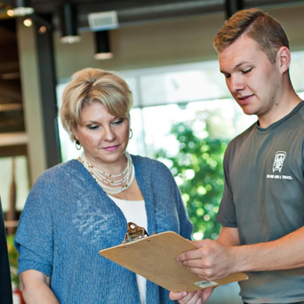 Woman talking with moving team