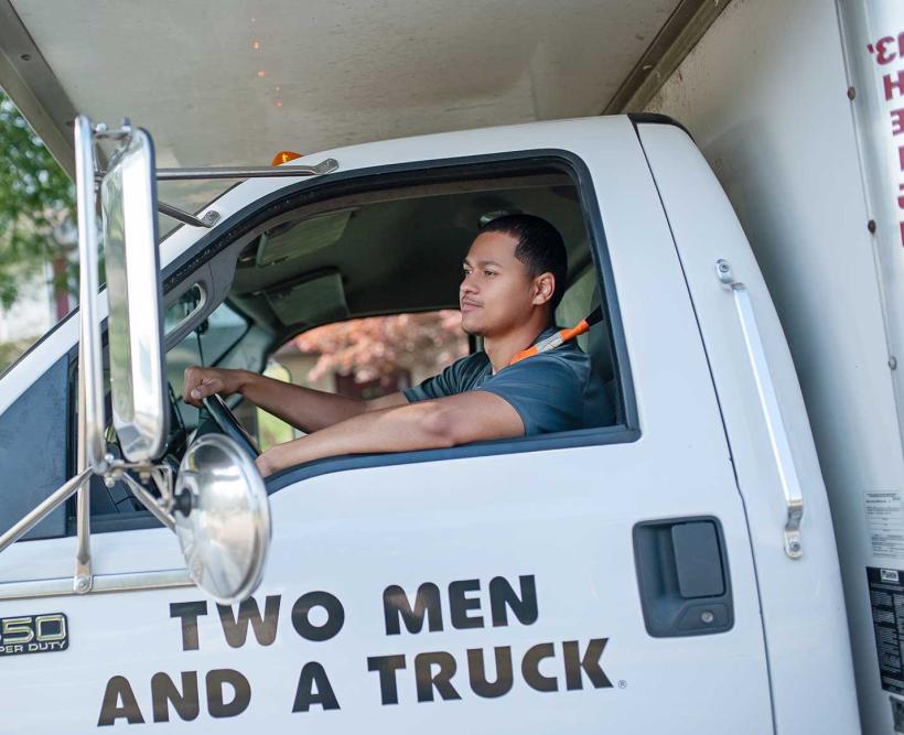 a mover in the cab of a truck