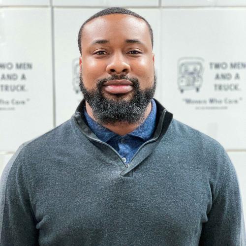 duval gregory standing in front of TWO MEN AND A TRUCK moving boxes