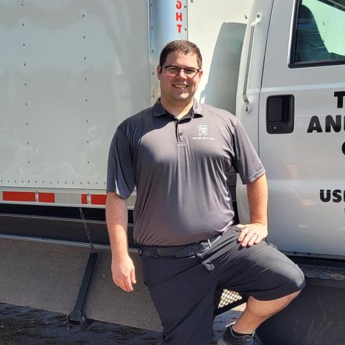 Jared is our move manager and is possing in front of one of our trucks