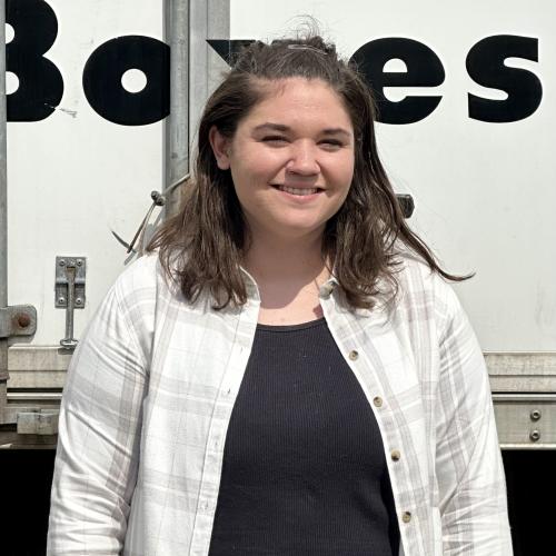 Erin standing next to truck