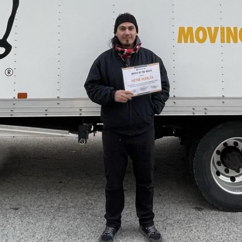 Victor in front of Moving Truck