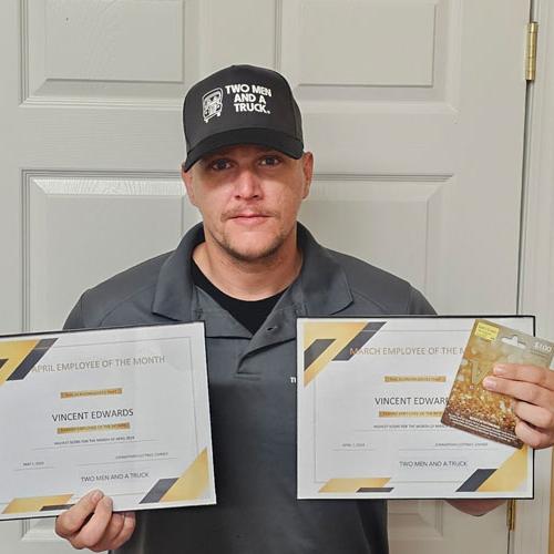 Vincent - Driver with two men and a truck holding two employee of the month certificates