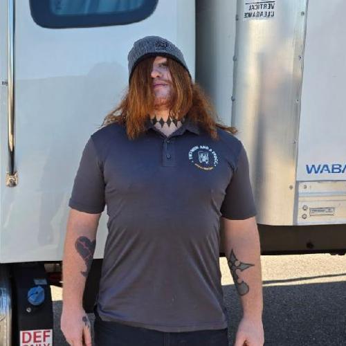 Man standing beside moving truck