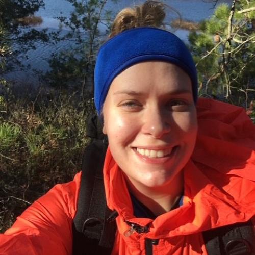 Kelly snapping a selfie on a hike