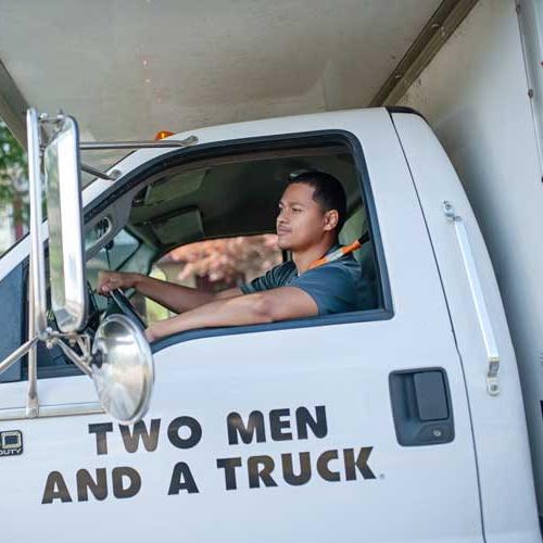 A mover behind the wheel of a truck