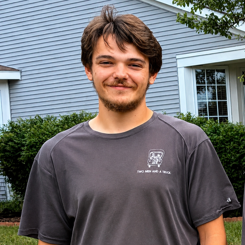 Austin in front of a home in Rockford
