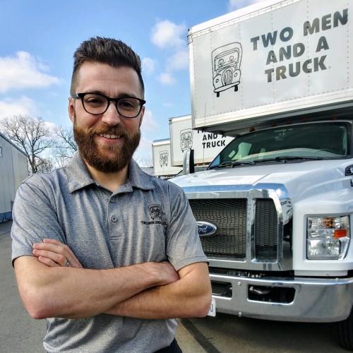 Andy standing in front of our moving truck