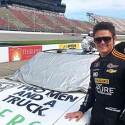Gray Gaulding in front of racecar