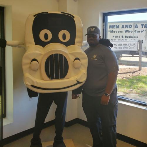 Jonathan - driver with two men and a truck standing next to our mascot truckie