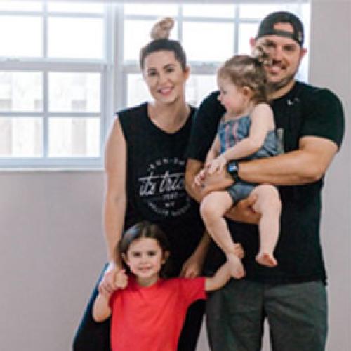 Kristen lecOUMPTE standing with family