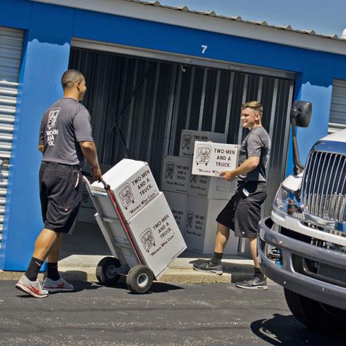 Two men and a truck movers providing storage services