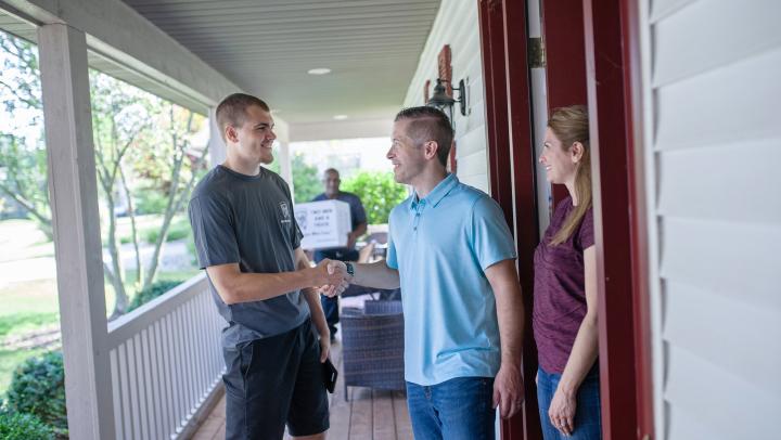 TWO MEN AND A TRUCK mover greeting customers 