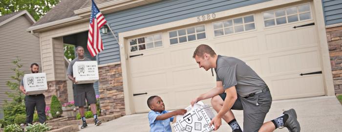 Movers talking with kid during a move