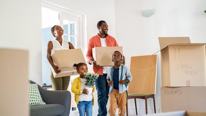 A Family Moving Into A New Home 