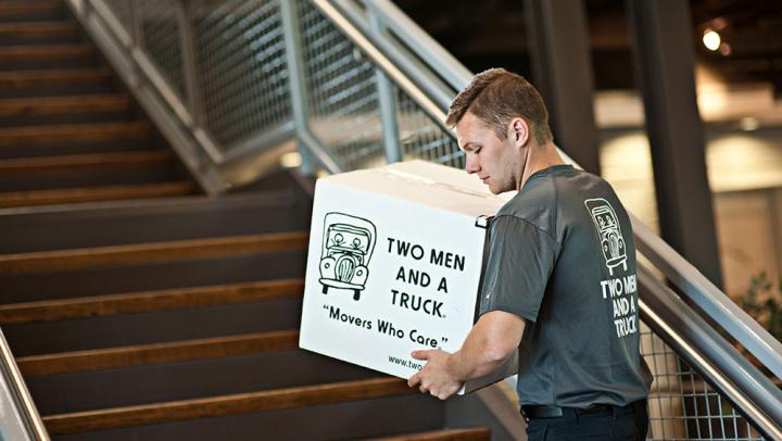 Mover carrying box upstairs Thumbnail