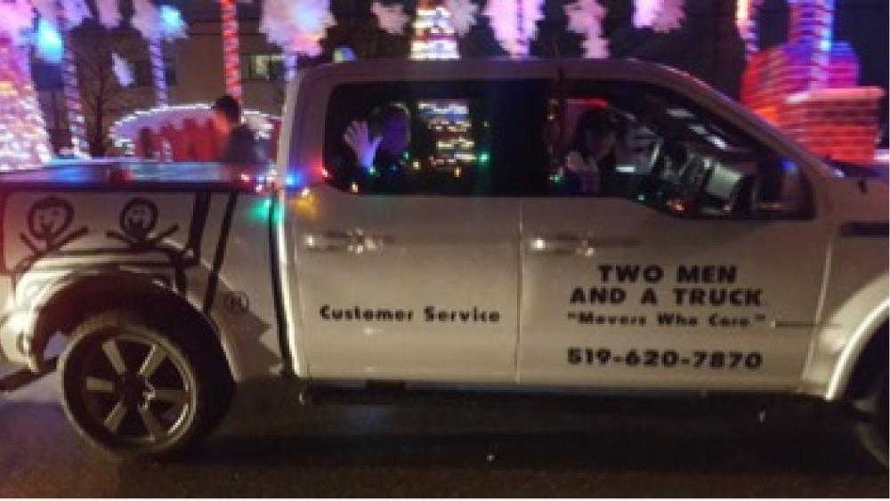 two men and a truck staff with movers for moms items