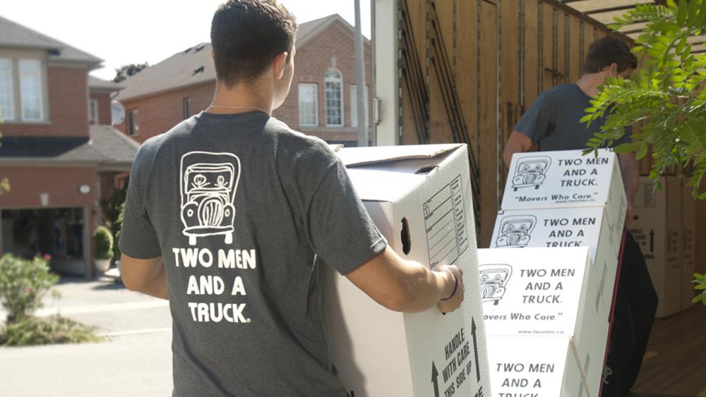 two men and a truck movers move dresses